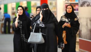 Saudi Arabian women wearing the traditional “Abaya”